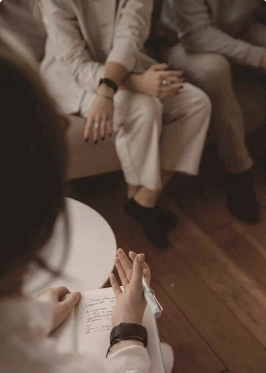 A couple on the sofa with their counsellor during a couples counselling session at Metanoia Counselling, Doncaster
